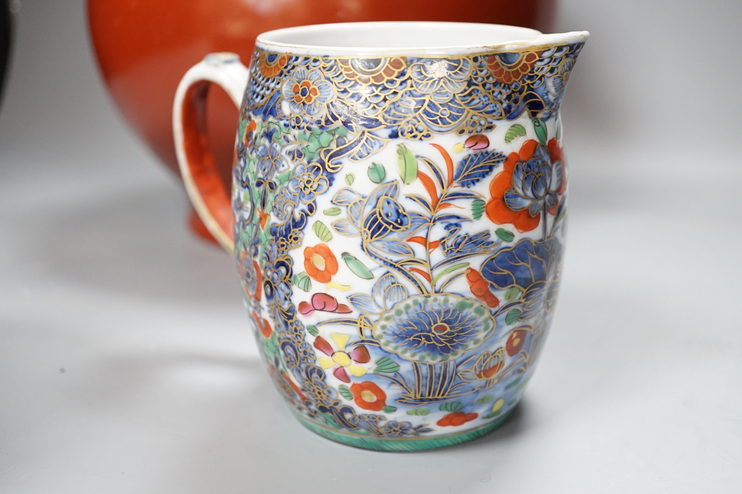 A 19th century Chinese famille rose pot and cover, 15cm diam., together with a decorative Chinese jug and large monochrome china pot